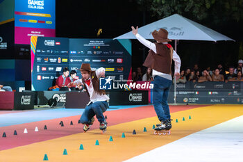 11/09/2024 - The Chinese couple, Li Ran and Sun Xin Zhao, third place in the final of the Inline Freestyle Pair Slalom specialty, during the 