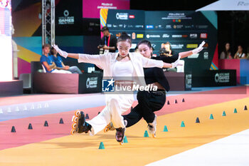 11/09/2024 - The Chinese couple, Zhu Si Yi and Xu Xiao Xiao, first place in the final of the Inline Freestyle Pair Slalom specialty, during the 