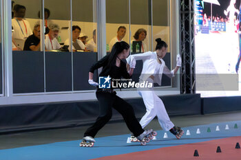 11/09/2024 - The Chinese couple, Zhu Si Yi and Xu Xiao Xiao, first place in the final of the Inline Freestyle Pair Slalom specialty, during the 