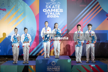 11/09/2024 - The podium, during the award ceremony, in the final of the Inline Freestyle Pair Slalom specialty, during the 