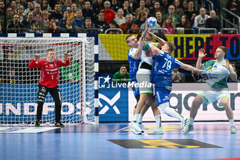 2024-01-11 - Foul of Teis Horn Rasmussen (Faore Islands) on Dean Bombac (Slovenia) during the Men’s EHF Euro 2024 match between Slovenia vs. Faroe Islands at the Mercedes-Benz Arena in Berlin, Germany - MEN'S EHF EURO 2024 - SLOVENIA VS FAROE ISLAND - HANDBALL - OTHER SPORTS