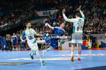 2024-01-11 - Elias Ellefsen a Skipagotu (Faore Islands) in action against Nejc Cehte (Slovenia) during the Men’s EHF Euro 2024 match between Slovenia vs. Faroe Islands at the Mercedes-Benz Arena in Berlin, Germany - MEN'S EHF EURO 2024 - SLOVENIA VS FAROE ISLAND - HANDBALL - OTHER SPORTS