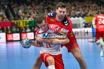 2024-01-11 - Mikolaj Czaplinski (Poland) in action against Harald Reinkind (Norway) during the Men’s EHF Euro 2024 match between Norway vs. Poland at the Mercedes-Benz Arena in Berlin, Germany - MEN'S EHF EURO 2024 - NORWAY VS POLAND - HANDBALL - OTHER SPORTS