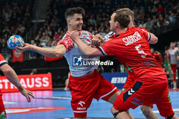 2024-01-11 - Szymon Sicko (Poland) in action against Sander Sagosen (Norway) during the Men’s EHF Euro 2024 match between Norway vs. Poland at the Mercedes-Benz Arena in Berlin, Germany - MEN'S EHF EURO 2024 - NORWAY VS POLAND - HANDBALL - OTHER SPORTS