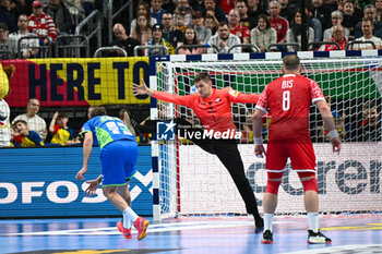 2024-01-13 - Dean Bombac (Slovenia) scores a goal from 7 meter during the Men’s EHF Euro 2024 match between Slovenia vs.Poland at the Mercedes-Benz Arena in Berlin, Germany - MEN'S EHF EURO 2024 - POLAND VS SLOVENIA - HANDBALL - OTHER SPORTS