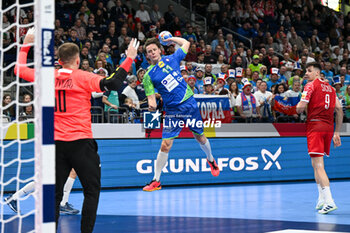2024-01-13 - Dolenec Jure (Slovenia) scores a goal during the Men’s EHF Euro 2024 match between Slovenia vs.Poland at the Mercedes-Benz Arena in Berlin, Germany - MEN'S EHF EURO 2024 - POLAND VS SLOVENIA - HANDBALL - OTHER SPORTS