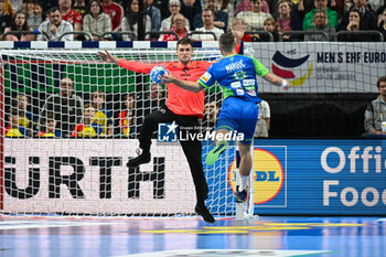 2024-01-13 - Gasper Marguc (Slovenia) scores a goal during the Men’s EHF Euro 2024 match between Slovenia vs.Poland at the Mercedes-Benz Arena in Berlin, Germany - MEN'S EHF EURO 2024 - POLAND VS SLOVENIA - HANDBALL - OTHER SPORTS