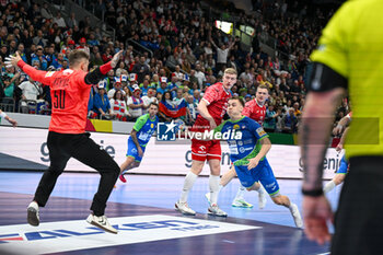 2024-01-13 - Stas Jovicic Slatinsek (Slovenia) scores a goal during the Men’s EHF Euro 2024 match between Slovenia vs.Poland at the Mercedes-Benz Arena in Berlin, Germany - MEN'S EHF EURO 2024 - POLAND VS SLOVENIA - HANDBALL - OTHER SPORTS