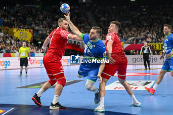 2024-01-13 - Aleks Vlah (Slovenia) in action against Bartlomiej Bis (Poland) during the Men’s EHF Euro 2024 match between Slovenia vs.Poland at the Mercedes-Benz Arena in Berlin, Germany - MEN'S EHF EURO 2024 - POLAND VS SLOVENIA - HANDBALL - OTHER SPORTS