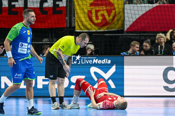 2024-01-13 - Injury of Michal Jedraszczyk (Poland) during the Men’s EHF Euro 2024 match between Slovenia vs.Poland at the Mercedes-Benz Arena in Berlin, Germany - MEN'S EHF EURO 2024 - POLAND VS SLOVENIA - HANDBALL - OTHER SPORTS