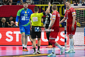 2024-01-13 - Matic Suholeznik (Slovenia) complain with the referee for 2 minutes suspenction during the Men’s EHF Euro 2024 match between Slovenia vs.Poland at the Mercedes-Benz Arena in Berlin, Germany - MEN'S EHF EURO 2024 - POLAND VS SLOVENIA - HANDBALL - OTHER SPORTS