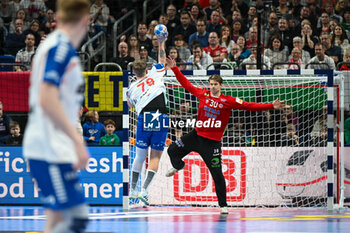 2024-01-13 - Torbjorn Sittrup Bergerud (Norway) saves the ball from Teis Horn Rasmussen (Faore Islands) during the Men’s EHF Euro 2024 match between Faroe Islands vs.Norway at the Mercedes-Benz Arena in Berlin, Germany - MEN'S EHF EURO 2024 - FAROE ISLANDS VS NORWAY - HANDBALL - OTHER SPORTS