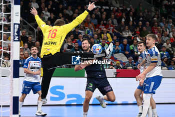 2024-01-13 - Goalkeeper Nicholas Satchwell (Faore Islands) saves the ball from the Harald Reinkind (Norway) shoot during the Men’s EHF Euro 2024 match between Faroe Islands vs.Norway at the Mercedes-Benz Arena in Berlin, Germany - MEN'S EHF EURO 2024 - FAROE ISLANDS VS NORWAY - HANDBALL - OTHER SPORTS