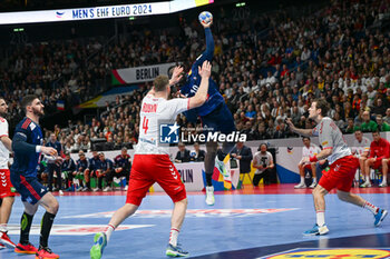 2024-01-14 - Dika Mem (France) in action against Lenny Rubin (Swiss) during the Men’s EHF Euro 2024 match between Swiss vs. France at the Mercedes-Benz Arena in Berlin, Germany - MEN'S EHF EURO 2024 - SWITZERLAND VS FRANCE - HANDBALL - OTHER SPORTS