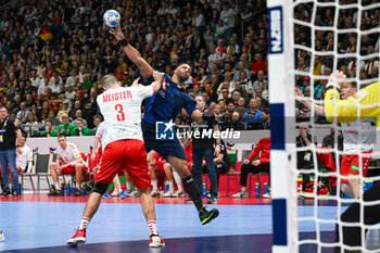 2024-01-14 - Timothey N'guessan (France) in action against Lucas Meister (Swiss) during the Men’s EHF Euro 2024 match between Swiss vs. France at the Mercedes-Benz Arena in Berlin, Germany - MEN'S EHF EURO 2024 - SWITZERLAND VS FRANCE - HANDBALL - OTHER SPORTS