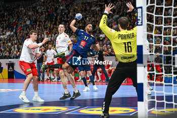 2024-01-14 - Timothey N'guessan (France) in action against Nikola Portner (Swiss) during the Men’s EHF Euro 2024 match between Swiss vs. France at the Mercedes-Benz Arena in Berlin, Germany - MEN'S EHF EURO 2024 - SWITZERLAND VS FRANCE - HANDBALL - OTHER SPORTS