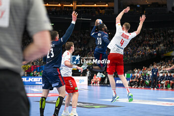 2024-01-14 - Dika Mem (France) in action against Lenny Rubin (Swiss) during the Men’s EHF Euro 2024 match between Swiss vs. France at the Mercedes-Benz Arena in Berlin, Germany - MEN'S EHF EURO 2024 - SWITZERLAND VS FRANCE - HANDBALL - OTHER SPORTS