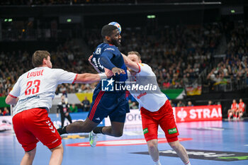 2024-01-14 - Dika Mem (France) in action against Lukas Laube (Swiss) during the Men’s EHF Euro 2024 match between Swiss vs. France at the Mercedes-Benz Arena in Berlin, Germany - MEN'S EHF EURO 2024 - SWITZERLAND VS FRANCE - HANDBALL - OTHER SPORTS