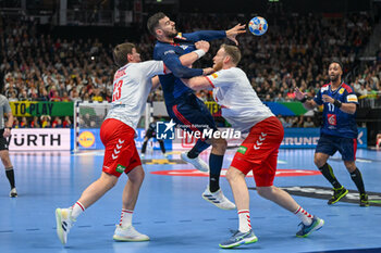 2024-01-14 - Ludovic Fabregas (France) in action against Lukas Laube (Swiss) during the Men’s EHF Euro 2024 match between Swiss vs. France at the Mercedes-Benz Arena in Berlin, Germany - MEN'S EHF EURO 2024 - SWITZERLAND VS FRANCE - HANDBALL - OTHER SPORTS