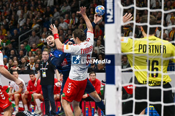 2024-01-14 - Nedim Remili (France) in action against Cedrie Tynowski (Swiss) during the Men’s EHF Euro 2024 match between Swiss vs. France at the Mercedes-Benz Arena in Berlin, Germany - MEN'S EHF EURO 2024 - SWITZERLAND VS FRANCE - HANDBALL - OTHER SPORTS