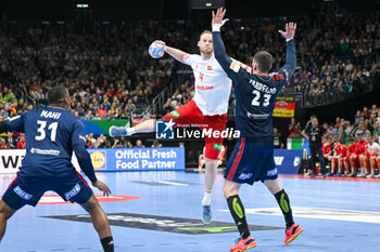 2024-01-14 - Lenny Rubin (Swiss) in action against Ludovic Fabregas (France) during the Men’s EHF Euro 2024 match between Swiss vs. France at the Mercedes-Benz Arena in Berlin, Germany - MEN'S EHF EURO 2024 - SWITZERLAND VS FRANCE - HANDBALL - OTHER SPORTS