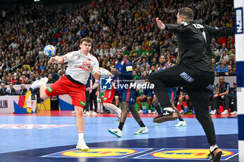 2024-01-14 - Lukas Laube (Swiss) scores a goal against Samir Bellahcene (France) during the Men’s EHF Euro 2024 match between Swiss vs. France at the Mercedes-Benz Arena in Berlin, Germany - MEN'S EHF EURO 2024 - SWITZERLAND VS FRANCE - HANDBALL - OTHER SPORTS