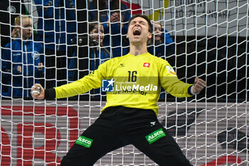 2024-01-14 - Happiness of Nikola Portner (Swiss) after saves the ball from 7 meter during the Men’s EHF Euro 2024 match between Swiss vs. France at the Mercedes-Benz Arena in Berlin, Germany - MEN'S EHF EURO 2024 - SWITZERLAND VS FRANCE - HANDBALL - OTHER SPORTS