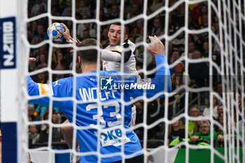 2024-01-14 - Zharko Peshevski (North Macedonia) in action against Andreas Wolff (Germany) during the Men’s EHF Euro 2024 match between North Macedonia vs. Germany at the Mercedes-Benz Arena in Berlin, Germany - MEN'S EHF EURO 2024 - NORTH MACEDONIA VS GERMANY - HANDBALL - OTHER SPORTS