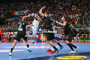 2024-01-14 - Marko Mitev (North Macedonia) in action against Johannes Golla (Germany) during the Men’s EHF Euro 2024 match between North Macedonia vs. Germany at the Mercedes-Benz Arena in Berlin, Germany - MEN'S EHF EURO 2024 - NORTH MACEDONIA VS GERMANY - HANDBALL - OTHER SPORTS