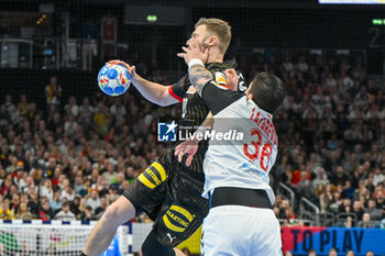 2024-01-14 - Foul of of Milan Lazarevski (North Macedonia) on Sebastian Firnhaber (Germany) during the Men’s EHF Euro 2024 match between North Macedonia vs. Germany at the Mercedes-Benz Arena in Berlin, Germany - MEN'S EHF EURO 2024 - NORTH MACEDONIA VS GERMANY - HANDBALL - OTHER SPORTS