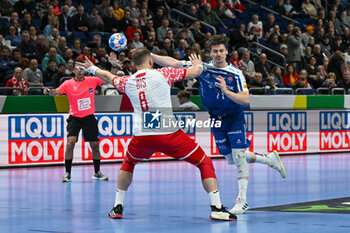 2024-01-15 - Elias Ellefsen a Skipagotu (Faore Islands) in action against Bartlomiej Bis (Poland) during the Men’s EHF Euro 2024 match between Poland vs. Faroe Islands at the Mercedes-Benz Arena in Berlin, Germany - MEN'S EHF EURO 2024 - POLAND VS FAROE ISLANDS - HANDBALL - OTHER SPORTS