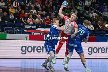 2024-01-15 - Michal Jedraszczyk (Poland) in action against Teis Horn Rasmussen (Faore Islands) during the Men’s EHF Euro 2024 match between Poland vs. Faroe Islands at the Mercedes-Benz Arena in Berlin, Germany - MEN'S EHF EURO 2024 - POLAND VS FAROE ISLANDS - HANDBALL - OTHER SPORTS