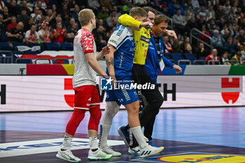 2024-01-15 - Injury of Goalkeeper Nicholas Satchwell (Faore Islands) during the Men’s EHF Euro 2024 match between Poland vs. Faroe Islands at the Mercedes-Benz Arena in Berlin, Germany - MEN'S EHF EURO 2024 - POLAND VS FAROE ISLANDS - HANDBALL - OTHER SPORTS