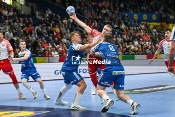 2024-01-15 - Michal Jedraszczyk (Poland) in action against Patur Mikkjalsson (Faore Islands) during the Men’s EHF Euro 2024 match between Poland vs. Faroe Islands at the Mercedes-Benz Arena in Berlin, Germany - MEN'S EHF EURO 2024 - POLAND VS FAROE ISLANDS - HANDBALL - OTHER SPORTS