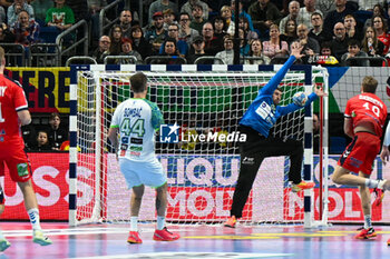 2024-01-15 - Goalkeeper Urban Lesjak (Slovenia) saves the ball during the Men’s EHF Euro 2024 match between Norway vs. Slovenia at the Mercedes-Benz Arena in Berlin, Germany - MEN'S EHF EURO 2024 - NORWAY VS SLOVENIA - HANDBALL - OTHER SPORTS