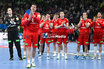 2024-01-16 - MVP of the match Andre Schmid (Swiss) and Swiss team greets the fans at the end of the match during the Men’s EHF Euro 2024 match between North Macedonia vs. Swiss at the Mercedes-Benz Arena in Berlin, Germany - MEN'S EHF EURO 2024 - NORTH MACEDONIA VS SWISS - HANDBALL - OTHER SPORTS