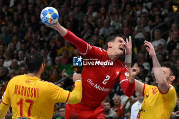 2024-01-16 - Andre Schmid (Swiss) in action against Tomislav Jagurinovski (North Macedonia) during the Men’s EHF Euro 2024 match between North Macedonia vs. Swiss at the Mercedes-Benz Arena in Berlin, Germany - MEN'S EHF EURO 2024 - NORTH MACEDONIA VS SWISS - HANDBALL - OTHER SPORTS