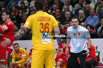 2024-01-16 - Head Coach Lazarov Kiril (North Macedonia) angry with Milan Lazarevski (North Macedonia) during the Men’s EHF Euro 2024 match between North Macedonia vs. Swiss at the Mercedes-Benz Arena in Berlin, Germany - MEN'S EHF EURO 2024 - NORTH MACEDONIA VS SWISS - HANDBALL - OTHER SPORTS