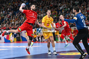 2024-01-16 - Lucas Meister (Swiss) in action against Martin Tomovski (North Macedonia) during the Men’s EHF Euro 2024 match between North Macedonia vs. Swiss at the Mercedes-Benz Arena in Berlin, Germany - MEN'S EHF EURO 2024 - NORTH MACEDONIA VS SWISS - HANDBALL - OTHER SPORTS