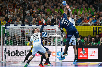 2024-01-16 - Nikola Karabatic (France) in action against Julian Koster (Germany) during the Men’s EHF Euro 2024 match between France vs. Germany at the Mercedes-Benz Arena in Berlin, Germany - MEN'S EHF EURO 2024 - FRANCE VS GERMANY - HANDBALL - OTHER SPORTS
