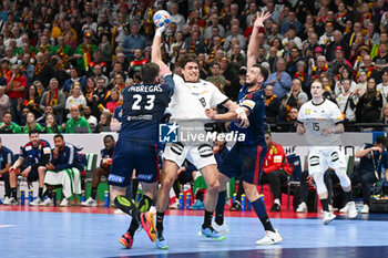 2024-01-16 - Ludovic Fabregas (France) in action against Julian Koster (Germany) during the Men’s EHF Euro 2024 match between France vs. Germany at the Mercedes-Benz Arena in Berlin, Germany - MEN'S EHF EURO 2024 - FRANCE VS GERMANY - HANDBALL - OTHER SPORTS