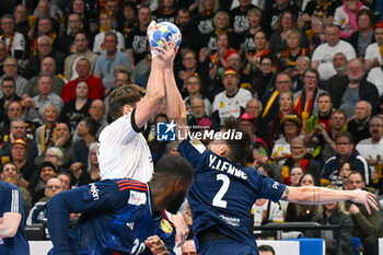 2024-01-16 - Yanis Lenne (France) block the shoot of Tim Nothdurft (Germany) during the Men’s EHF Euro 2024 match between France vs. Germany at the Mercedes-Benz Arena in Berlin, Germany - MEN'S EHF EURO 2024 - FRANCE VS GERMANY - HANDBALL - OTHER SPORTS
