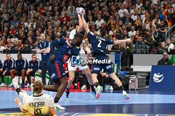 2024-01-16 - Yanis Lenne (France) block the shoot of Tim Nothdurft (Germany) during the Men’s EHF Euro 2024 match between France vs. Germany at the Mercedes-Benz Arena in Berlin, Germany - MEN'S EHF EURO 2024 - FRANCE VS GERMANY - HANDBALL - OTHER SPORTS