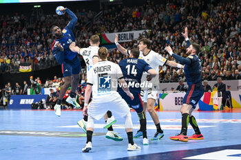 2024-01-16 - Dika Mem (France) in action against Johannes Golla (Germany) during the Men’s EHF Euro 2024 match between France vs. Germany at the Mercedes-Benz Arena in Berlin, Germany - MEN'S EHF EURO 2024 - FRANCE VS GERMANY - HANDBALL - OTHER SPORTS