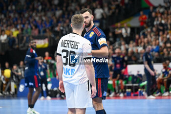 2024-01-16 - Face to face between Lukas Mertens (Germany) and Ludovic Fabregas (France) during the Men’s EHF Euro 2024 match between France vs. Germany at the Mercedes-Benz Arena in Berlin, Germany - MEN'S EHF EURO 2024 - FRANCE VS GERMANY - HANDBALL - OTHER SPORTS