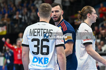 2024-01-16 - Face to face between Lukas Mertens (Germany) and Ludovic Fabregas (France) during the Men’s EHF Euro 2024 match between France vs. Germany at the Mercedes-Benz Arena in Berlin, Germany - MEN'S EHF EURO 2024 - FRANCE VS GERMANY - HANDBALL - OTHER SPORTS