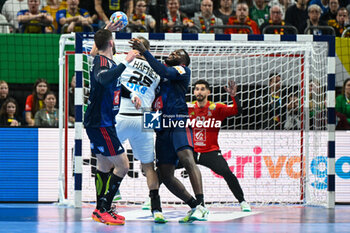2024-01-16 - Renars Uscins (Germany) in action against Dika Mem (France) during the Men’s EHF Euro 2024 match between France vs. Germany at the Mercedes-Benz Arena in Berlin, Germany - MEN'S EHF EURO 2024 - FRANCE VS GERMANY - HANDBALL - OTHER SPORTS