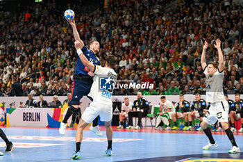 2024-01-16 - Kentin Mahe (France) in action against Julian Koster (Germany) during the Men’s EHF Euro 2024 match between France vs. Germany at the Mercedes-Benz Arena in Berlin, Germany - MEN'S EHF EURO 2024 - FRANCE VS GERMANY - HANDBALL - OTHER SPORTS