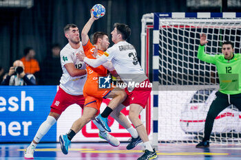 2024-01-11 - Luc Steins of The Netherlands is challenged by Erekle Arsenashvili and Miriani Gavashelishvili of Georgia during the Men's EHF Euro 2024, Group E football match between Netherlands and Georgia on January 11, 2024 at SAPP Arena in Mannheim, Germany - HANDBALL - MEN'S EHF EURO 2024 - NETHERLANDS V GEORGIA - HANDBALL - OTHER SPORTS