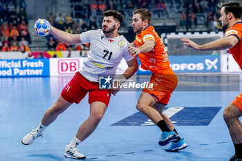2024-01-11 - Giorgi Arvelodi of Georgia is challenged by Luc Steins of The Netherlands during the Men's EHF Euro 2024, Group E football match between Netherlands and Georgia on January 11, 2024 at SAPP Arena in Mannheim, Germany - HANDBALL - MEN'S EHF EURO 2024 - NETHERLANDS V GEORGIA - HANDBALL - OTHER SPORTS